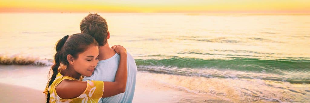 Couple in love hug banner panorama. Asian woman hugging embracin